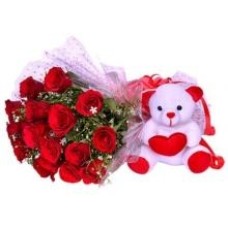 Rosas vermelhas e ursinho de pelúcia