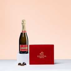 Caixa de veludo vermelho Godiva e champanhe Piper Heidsieck