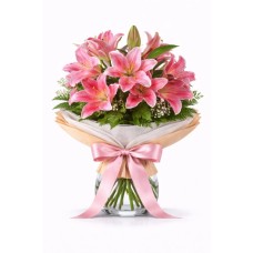 Lírios cor-de-rosa num vaso