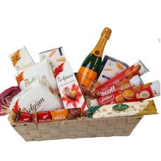 Cesta de presente com Veuve Clicquot (37,5 cl) e doces belgas.